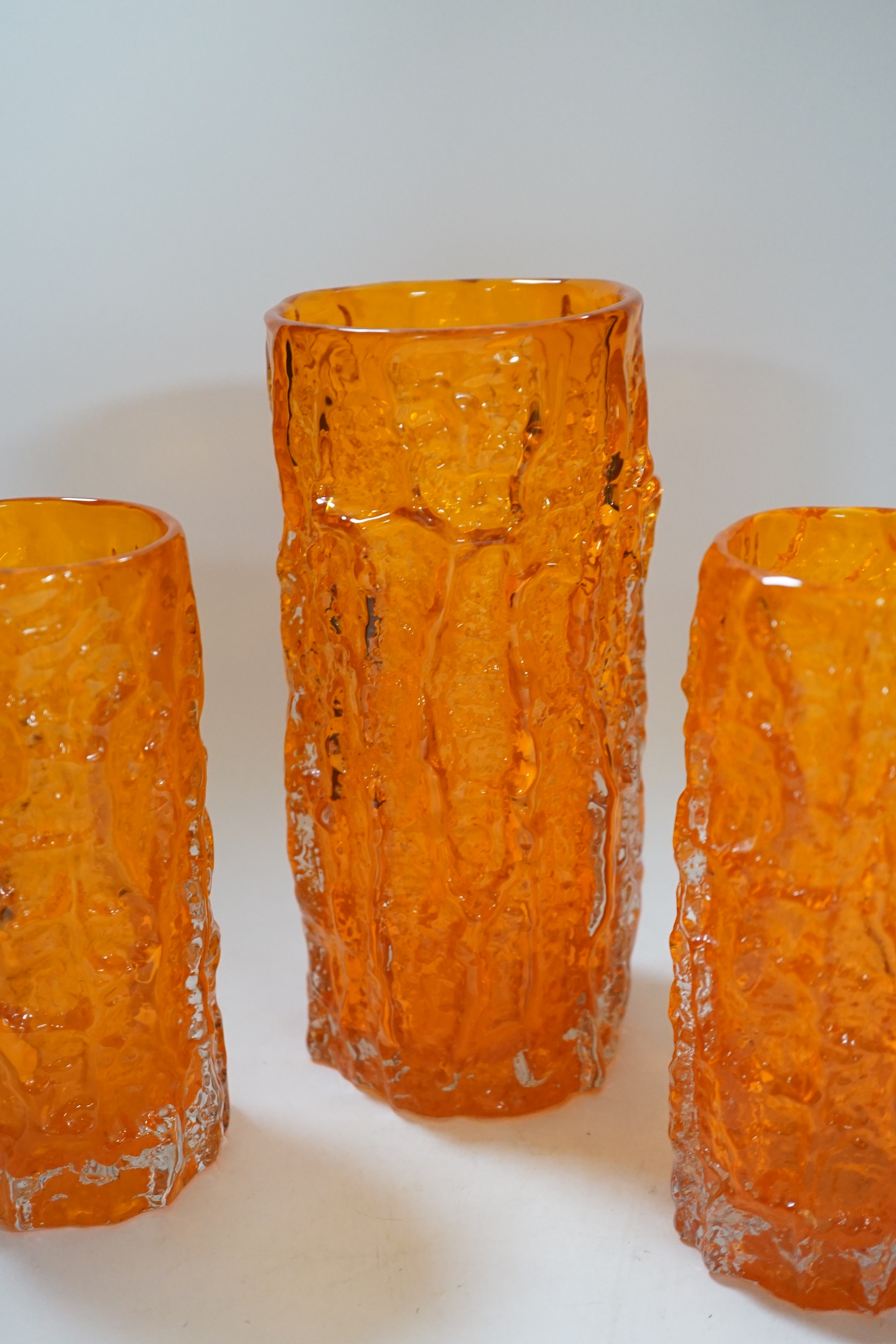 A pair and two other Whitefriars ‘bark’ vases in tangerine, tallest 24cm